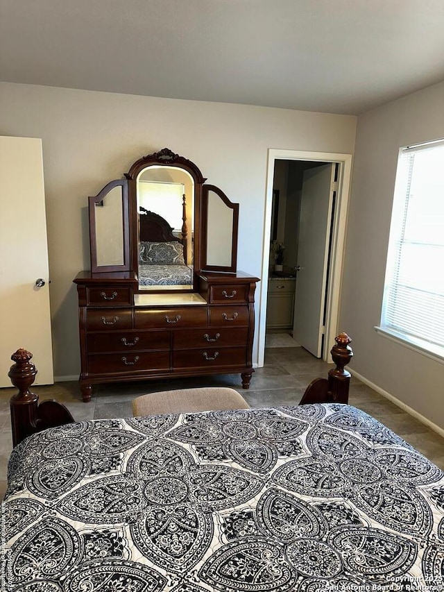 bedroom featuring connected bathroom