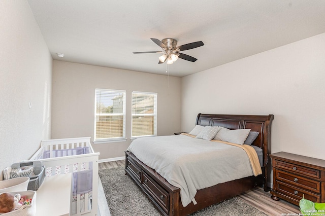 bedroom featuring ceiling fan and wood-type flooring