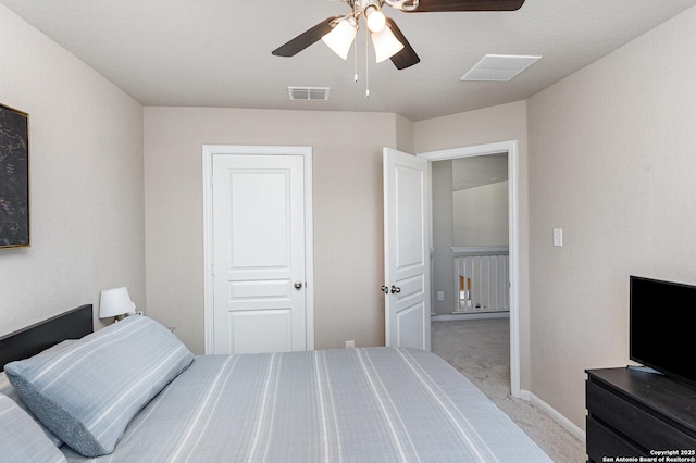 bedroom with light colored carpet and ceiling fan