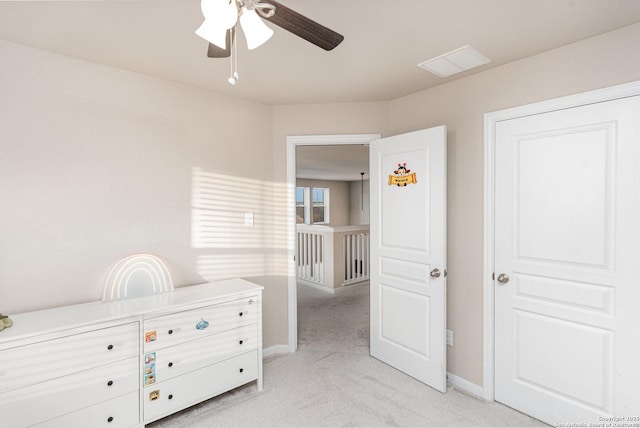 unfurnished bedroom featuring ceiling fan and light carpet