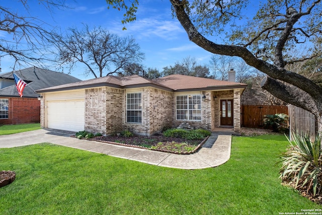 ranch-style house featuring a garage and a front yard