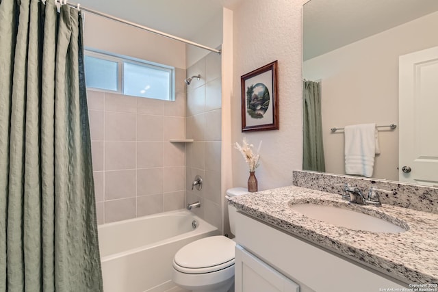 full bathroom with vanity, toilet, and shower / bath combo with shower curtain