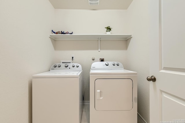 clothes washing area featuring washing machine and clothes dryer