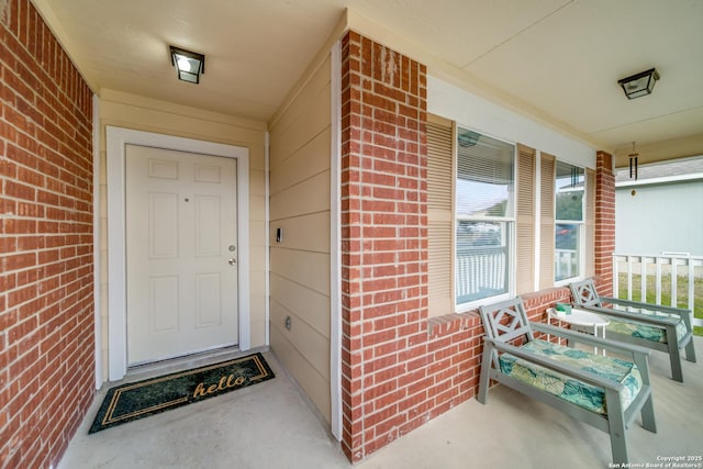 doorway to property with a porch