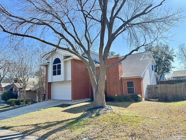 view of front of home featuring a garage and a front yard