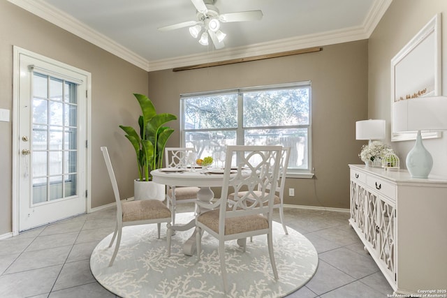 tiled dining room featuring crown molding and ceiling fan