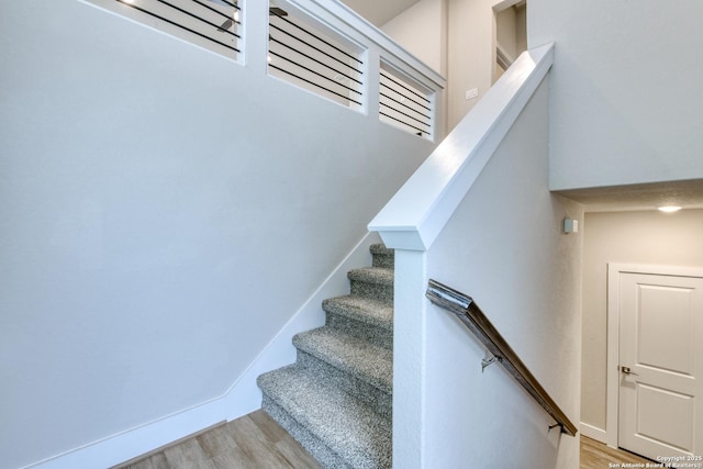 stairway featuring hardwood / wood-style flooring