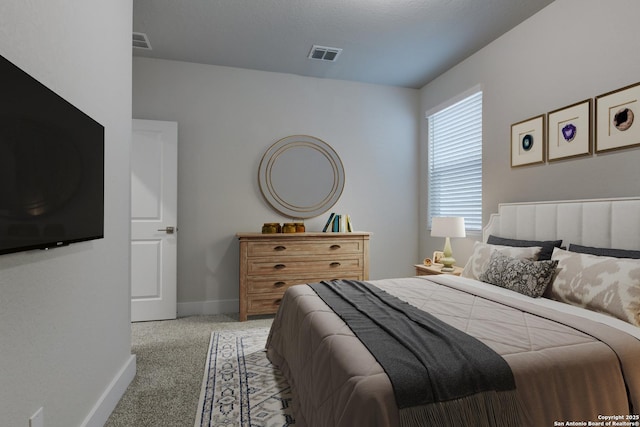 bedroom with light carpet