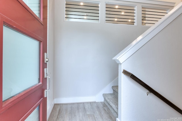 foyer entrance with light hardwood / wood-style flooring