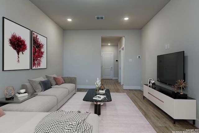 living room with light hardwood / wood-style floors