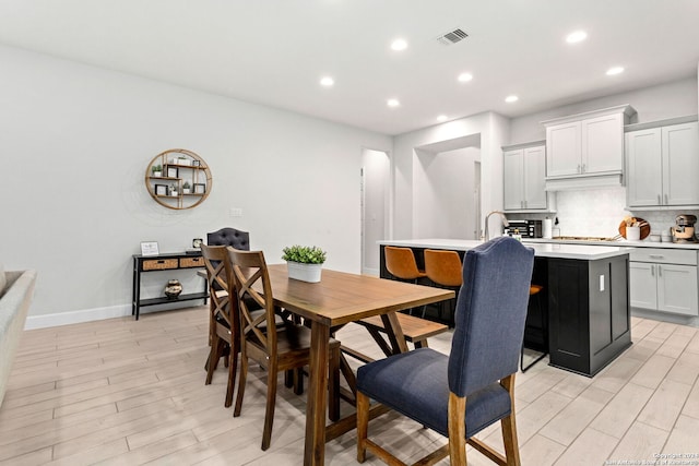 dining space featuring light hardwood / wood-style flooring