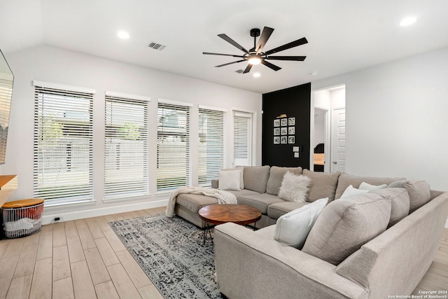 living room with ceiling fan and light hardwood / wood-style floors