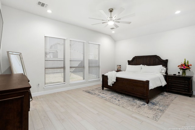 bedroom featuring vaulted ceiling, ceiling fan, and light wood-type flooring