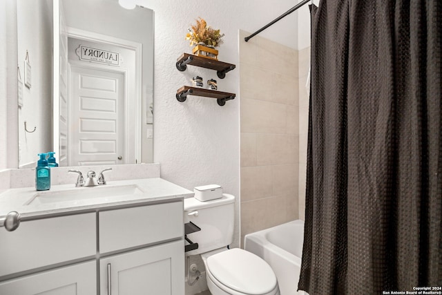 full bathroom featuring vanity, shower / tub combo, and toilet