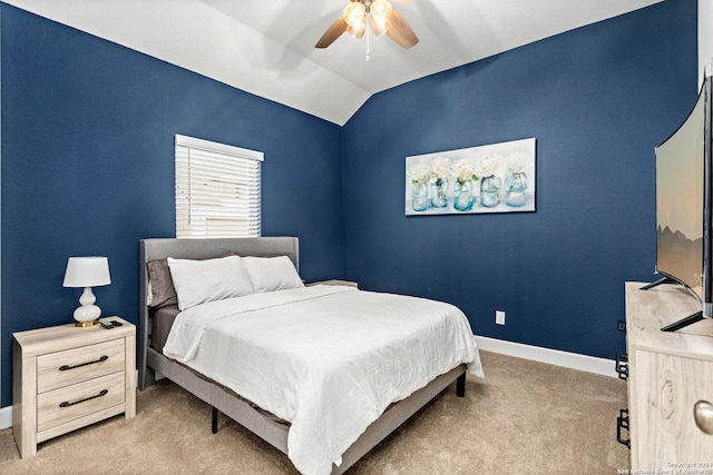 carpeted bedroom featuring ceiling fan and lofted ceiling