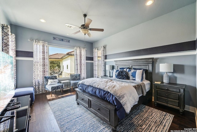 bedroom featuring dark hardwood / wood-style flooring and ceiling fan