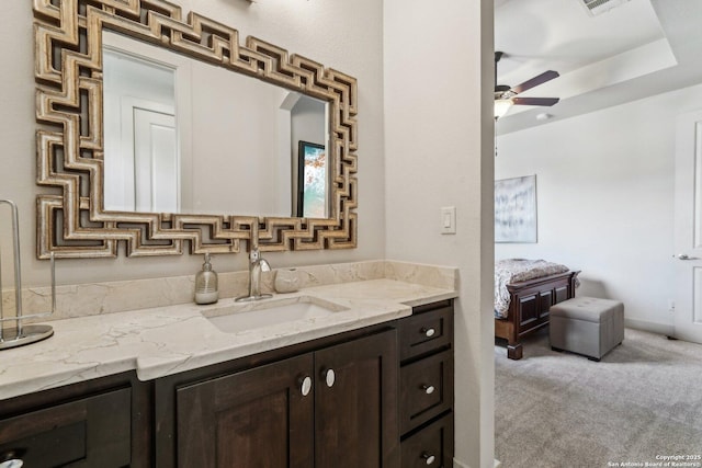 bathroom featuring ceiling fan and vanity