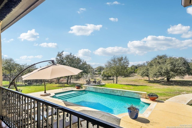 view of swimming pool featuring a patio and a yard