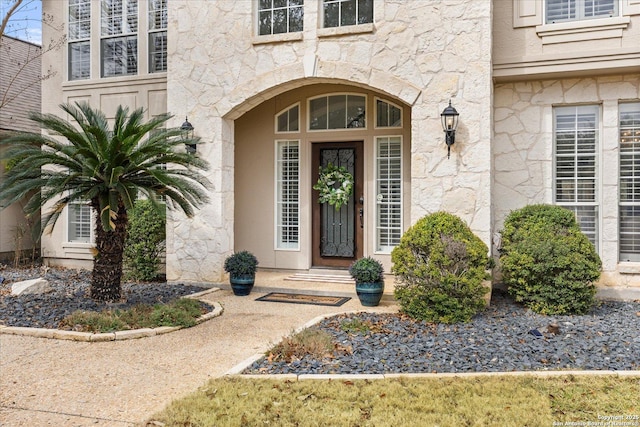 doorway to property with stucco siding