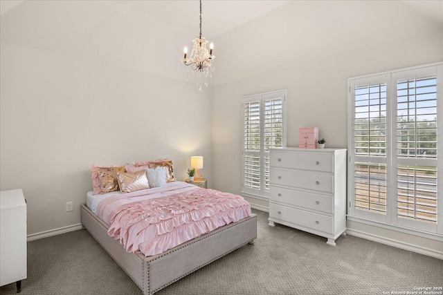 bedroom featuring baseboards, carpet floors, lofted ceiling, and an inviting chandelier