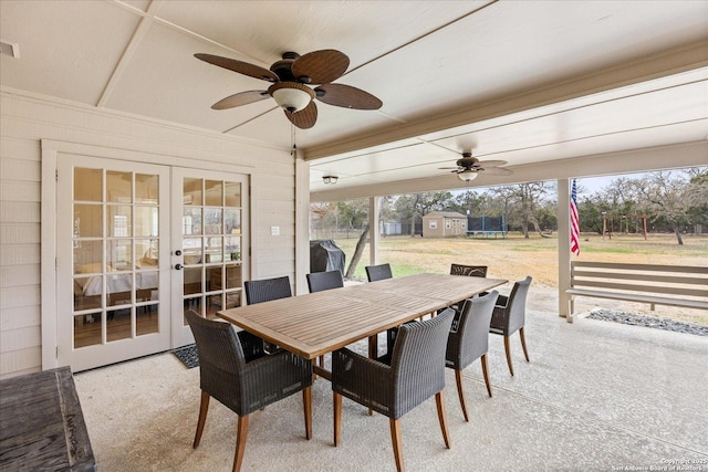 sunroom / solarium featuring french doors, visible vents, and ceiling fan