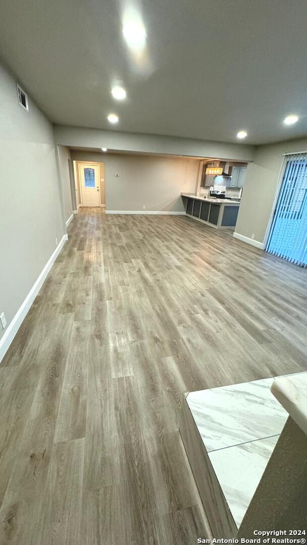 basement with wood-type flooring