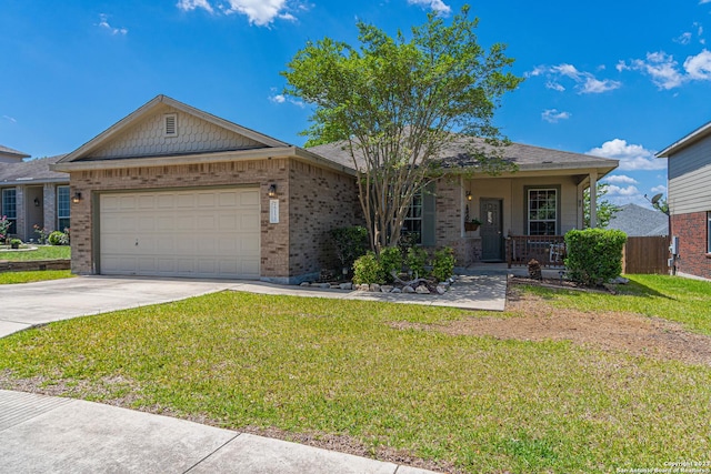 single story home with a porch, a garage, and a front yard