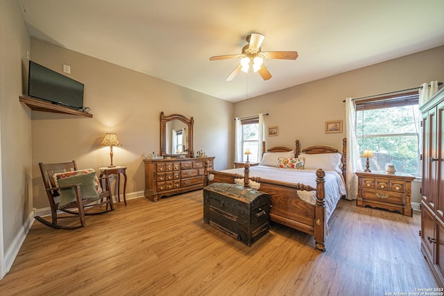 bedroom with ceiling fan and light wood-type flooring