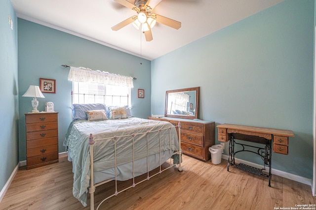 bedroom with ceiling fan and light hardwood / wood-style flooring