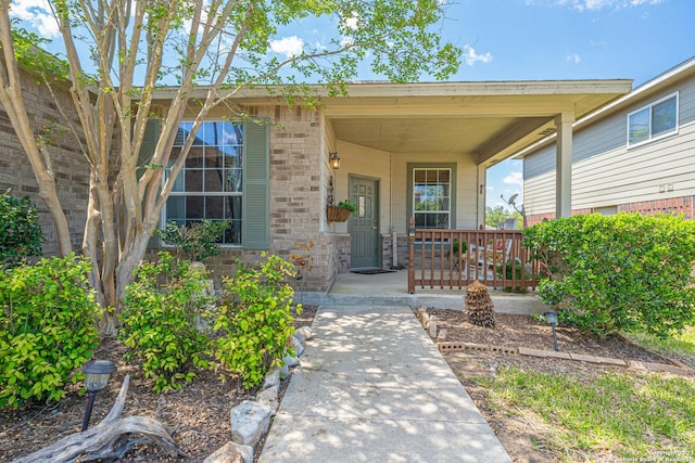 entrance to property with a porch