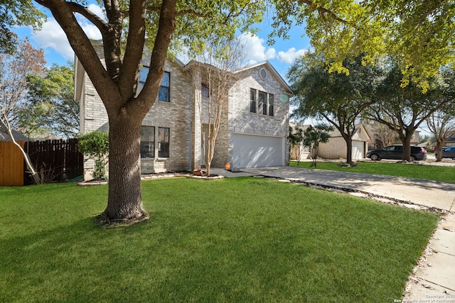 view of front facade with a garage and a front lawn