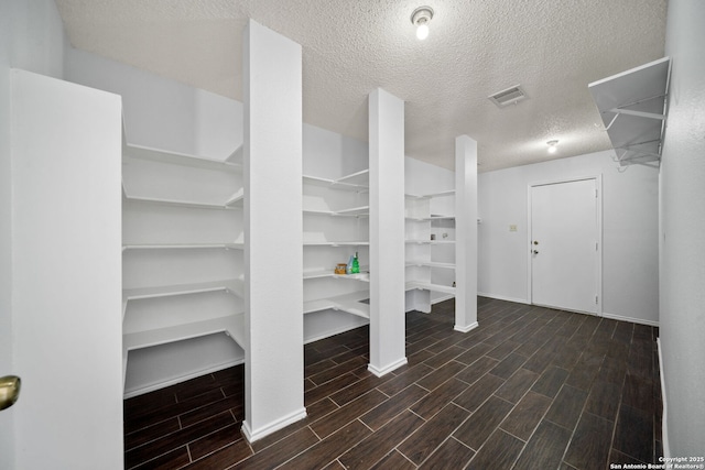 interior space featuring a textured ceiling