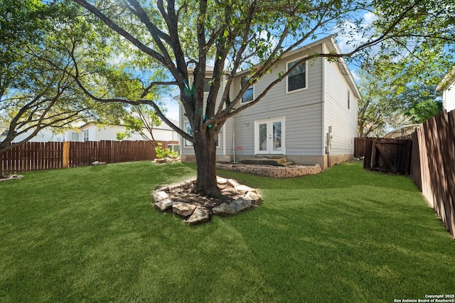 view of yard with french doors