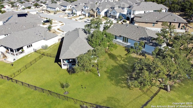 birds eye view of property with a residential view