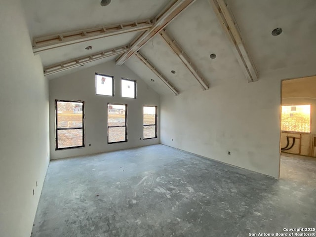 interior space featuring beamed ceiling and high vaulted ceiling