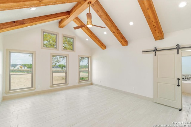 unfurnished living room featuring beam ceiling, high vaulted ceiling, light wood-type flooring, ceiling fan, and a barn door