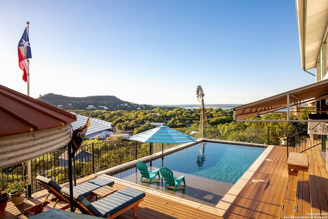 view of swimming pool featuring a mountain view