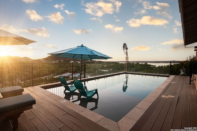 view of pool featuring a water view