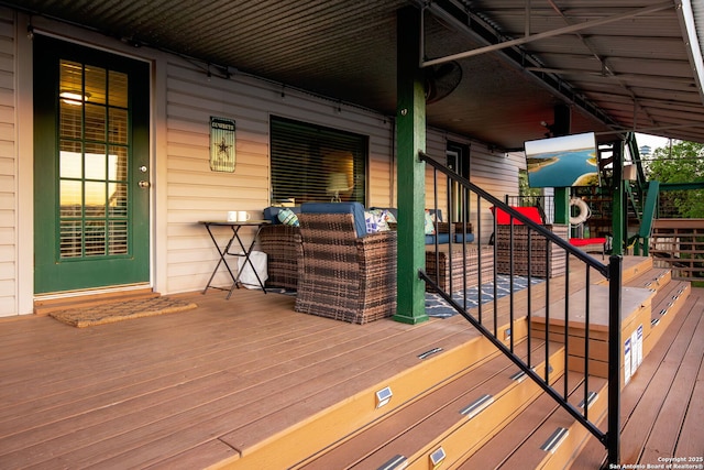 deck featuring a playground and outdoor lounge area