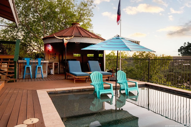 wooden terrace featuring an outdoor bar