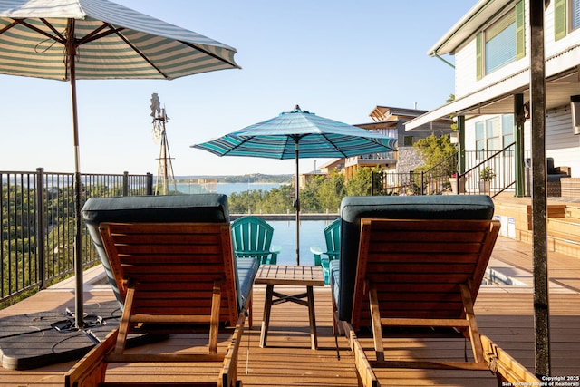 wooden terrace with a water view