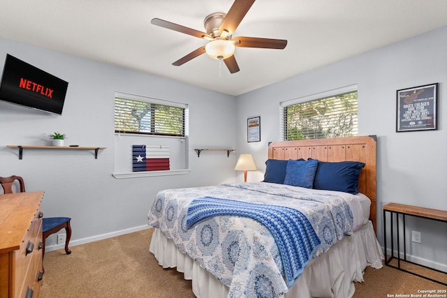 carpeted bedroom featuring ceiling fan