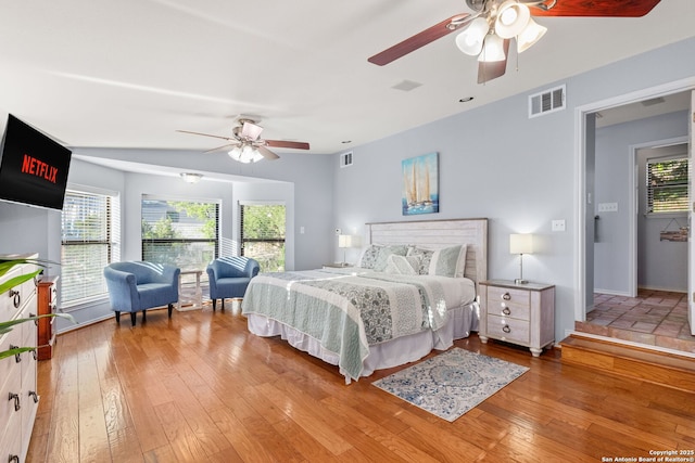 bedroom with hardwood / wood-style flooring and ceiling fan