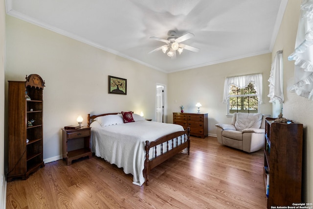 bedroom with wood-type flooring, ornamental molding, and ceiling fan