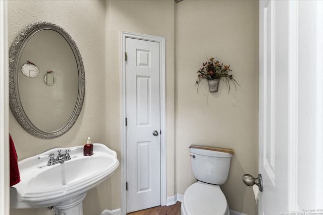 bathroom with toilet and sink