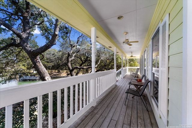 wooden terrace featuring ceiling fan