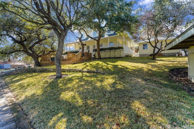 view of yard with a deck