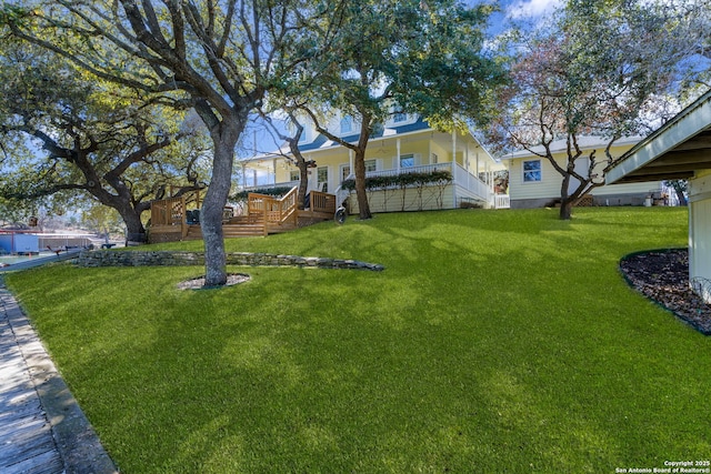 view of yard with a wooden deck