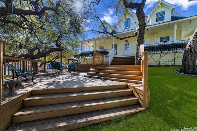 wooden terrace with a yard