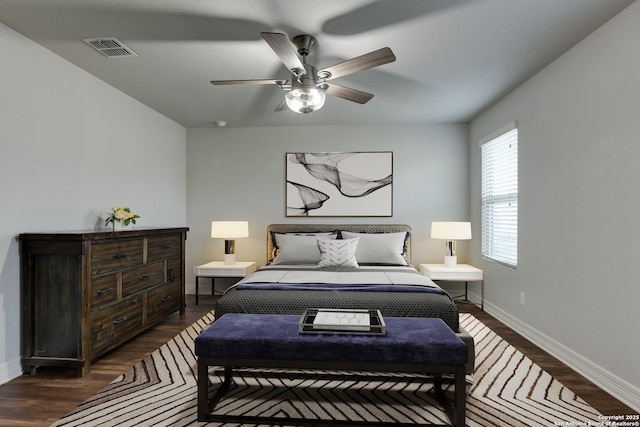 bedroom with ceiling fan and dark hardwood / wood-style flooring